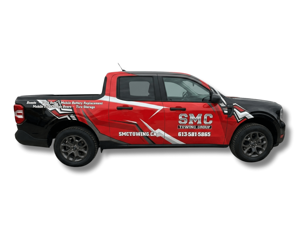 SMC Towing Truck with no background passenger side view of entire truck